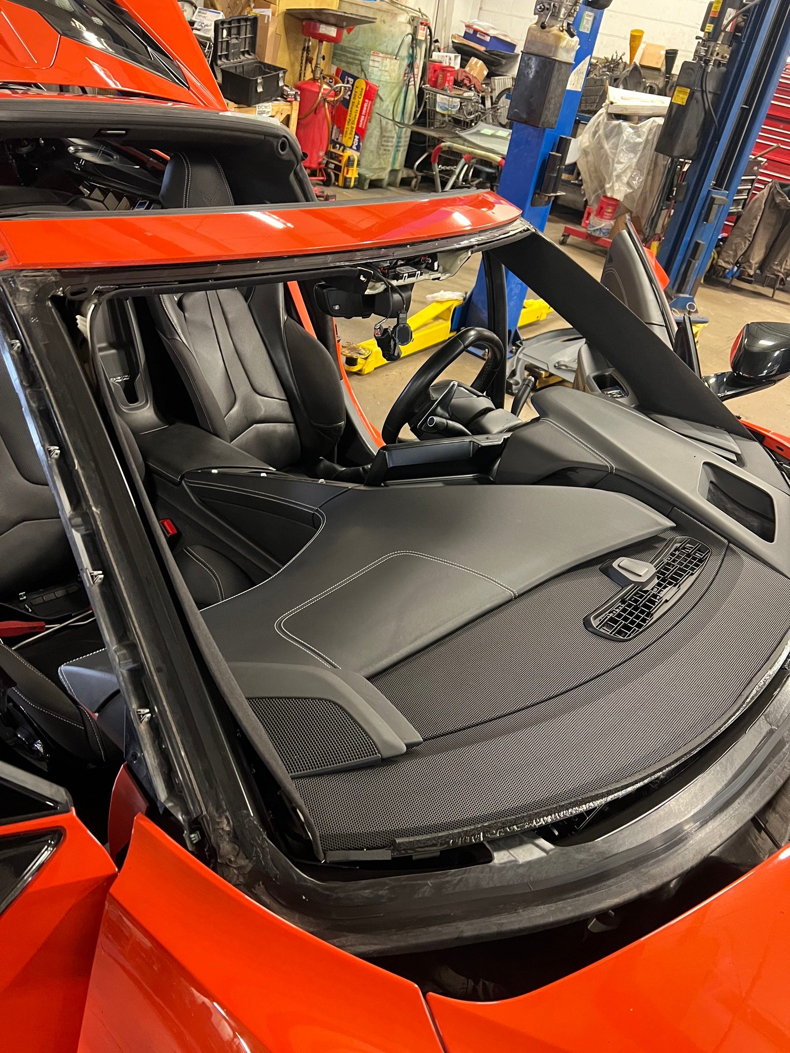 Forward camera hardware exposed during windshield work